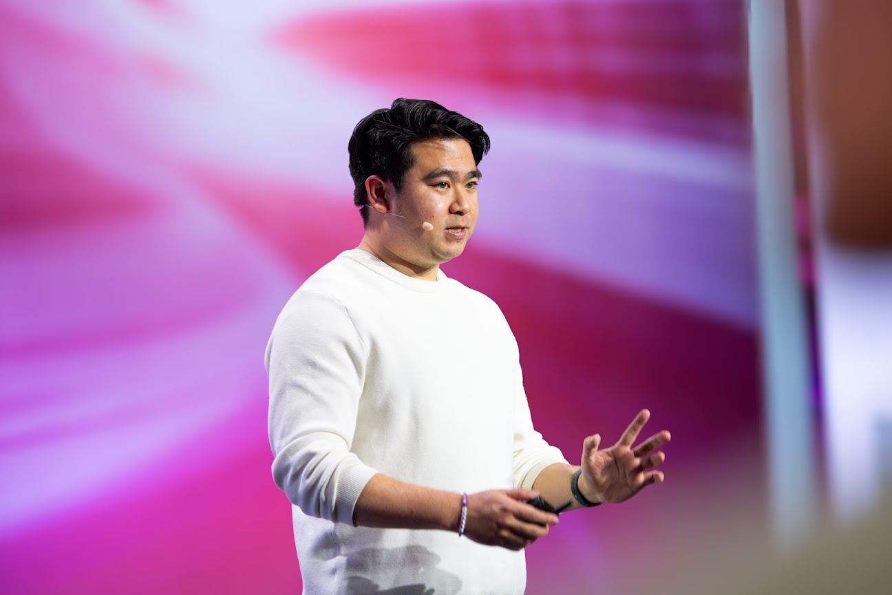 Jerrod Lew speaking on stage